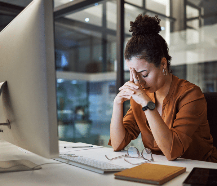 Frustrated employee waiting on a slow-loading dashboard